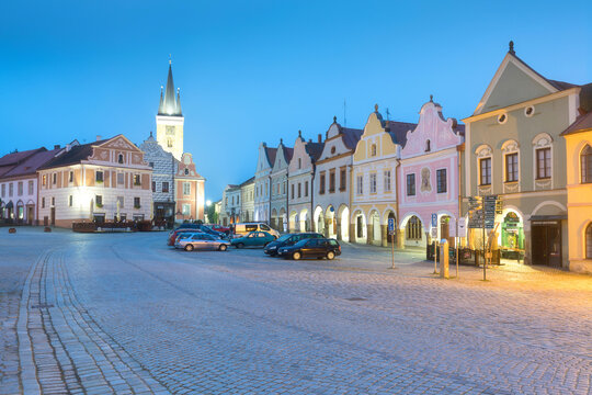 Traditional houses on the main square of Telc, South Moravia, Czech Republic. UNESCO heritage site. Town square in Telc with renaissance and baroque colorful houses. Early evening or night scene.