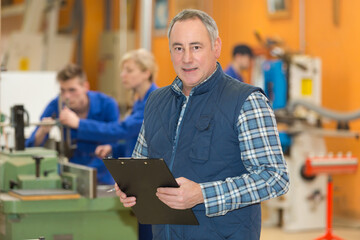businessman with clipboard at warehouse