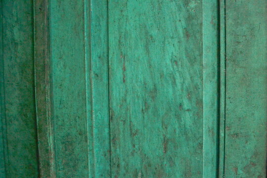 Background old wooden surface painted with peeling green paint © yasidakbar