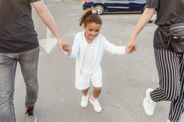 girl with dark hair and white clothes jumping a step