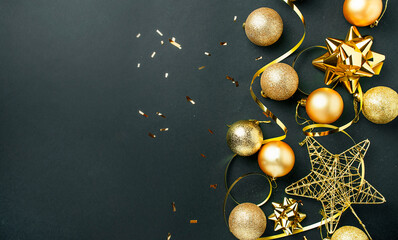 Christmas balls and toys on a dark background. Christmas background. New Year card. Copy space....