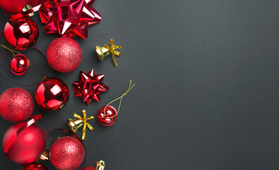 Christmas red balls and decorations on a dark background. New Year card. Christmas background. Copy space.