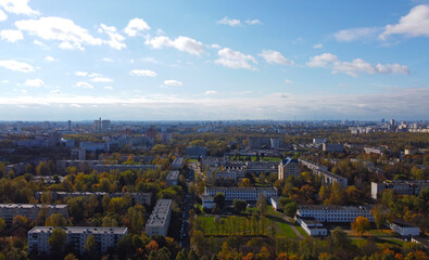 Top view of the autumn city with tenement houses and trees