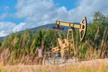 Oil pump. Oil industry equipment in Carpathian mountains.