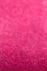 Pink abstract shiny background. Bright blur background of small sparkles. Festive glowing texture. For holidays design, decoration, poster, greeting, cards