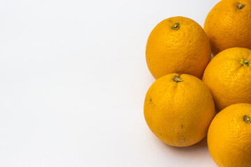 Composition with orange fruit on white isolated background