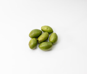 Delicious green raw olives on isolated white background