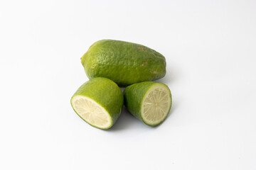 Fresh green sliced lemon on white background
