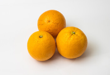 Fresh organic three orange on isolated white background