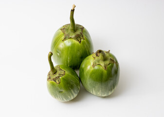 Three green thai eggplannt isolated on white