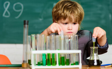biology science. school kid scientist studying science. Little boy is making science experiments. science experiments in lab. little boy at lesson. Back to school. In search of right medical solution