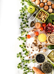 Assortment of healthy food. Top view of fruits, vegetables, cereals and seeds