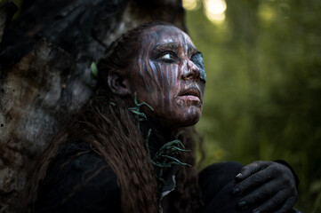Portrait of young beautiful woman with Halloween professional makeup