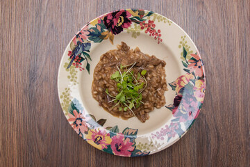 Risotto with pieces of ham and watercress