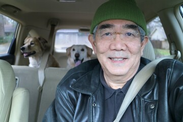 Road trip with mans best friends, two dogs going on a trip in a car.