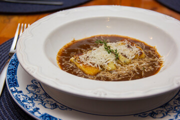 Gnocchi stuffed with ossobuco, ossobuco broth and grana padano cheese