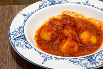 Homemade Italian potato gnocchi with tomato sauce