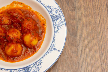 Homemade Italian potato gnocchi with tomato sauce