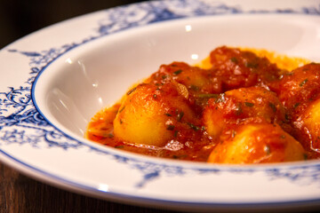 Homemade Italian potato gnocchi with tomato sauce