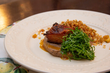 Fried bean with crunchy bacon, ground banana and cabbage