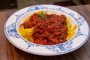 Pappardelle Pasta with meat rag. Typical dish of Tuscany.