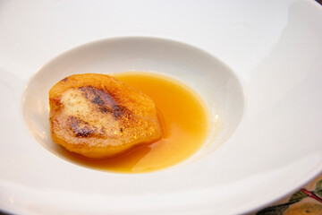 Dessert of pear brulee with dolce gorgonzola cheese