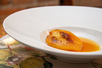 Dessert of pear brulee with dolce gorgonzola cheese