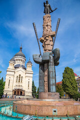 Fototapeta premium Statue of Avram Iancu and orthodox cathedral, Cluj Napoca, Romania