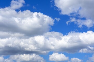 Naklejka na ściany i meble beautiful fluffy clouds on a bright blue summer sky