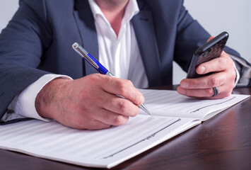 Businessman working in the office with documents on the table