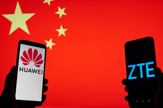 SARANSK, RUSSIA - OCTOBER 20, 2020: A smartphone screens shows logo of Huawei and ZTE, the Flag of China visible on the background.