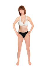 Fototapeta premium Full length portrait of a beautiful young woman wearing a bikini, isolated on white studio background