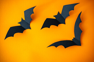 Fototapeta premium The composition decor for Halloween holiday. Halloween decorations on orange background. Halloween concept. Halloween holiday decorations
