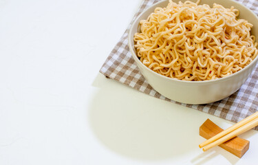 Plain noodles in a bowl, close-up shot. Copy space for text.