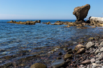 A large balancing rock on a rocky beach in Andalusia's largest coastal protected area, Cabo de Gata-N&iacute;jar Natural Park in the southeastern corner of Spain