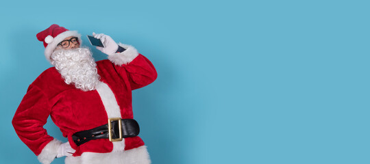 santa claus isolated on background with mobile phone