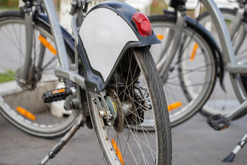 Bicycle rental station on public parking in the city
