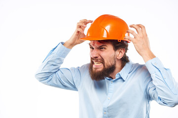 Angry man in orange hard hat industry work dissatisfaction cropped view