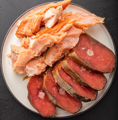 two types of fish, cold and hot smoked. Beer snack. top view