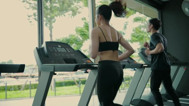 Fitness concept. An athlete running on a treadmill in fitness. 4k Resolution.