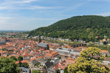 Fototapeta na wymiar Heidelberg, Germany, aerial view of the medieval city, the Church of the holy spirit, and the old bridges on Neckar river .