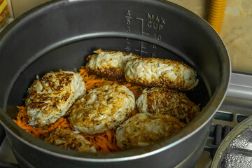 Homemade cutlets in a large pot close - up in the home kitchen. Homemade food