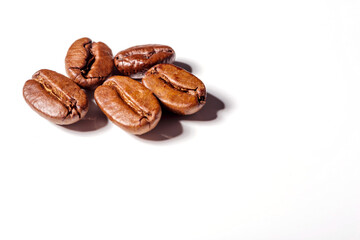 Heap of fresh roasted coffee beans isolated on white background as package design elements
