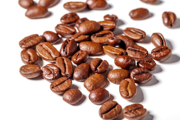 Heap of fresh roasted coffee beans isolated on white background as package design elements