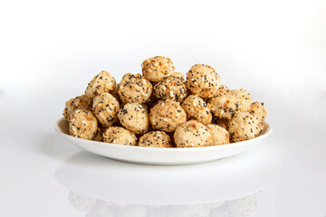 Cereal balloons with poppy seeds and sesame seeds on a plate healthy food