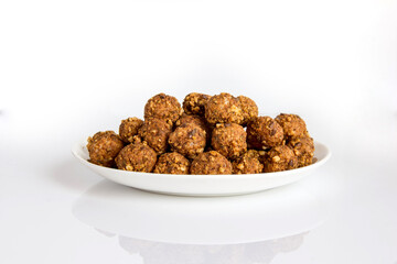 baked cereal balloons with nuts and seeds on a plate healthy food