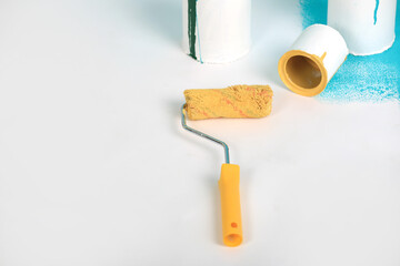 Instruments for renovation apartment room isolated on white and blue background. accessories for gluing, painting tools. Colorful paint cans. Concept of repair home. Copy space for advertisement