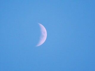 Obraz na płótnie Canvas White crescent moon in the clear sky