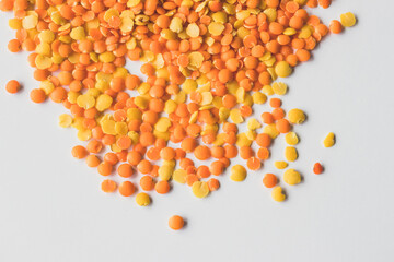 Glass pot  full of red and yellow lentils
