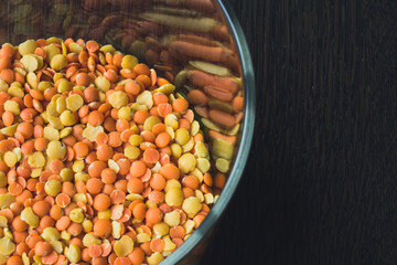 Glass pot  full of red and yellow lentils